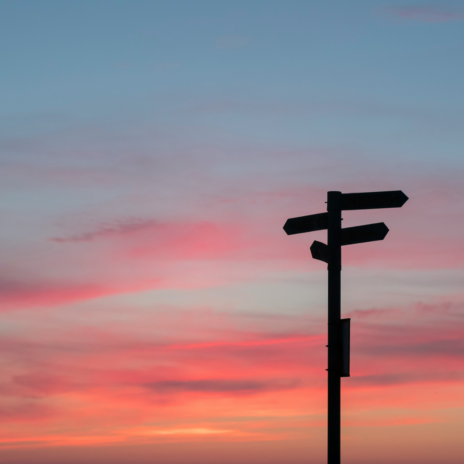 Decorative element: Crossroad sign in front of the evening sky