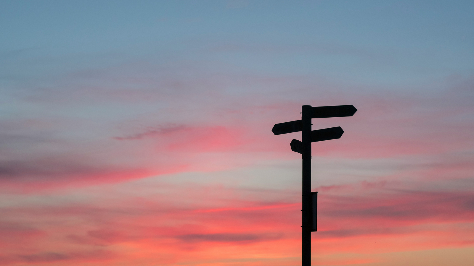 Decorative element: Crossroad sign in front of the evening sky