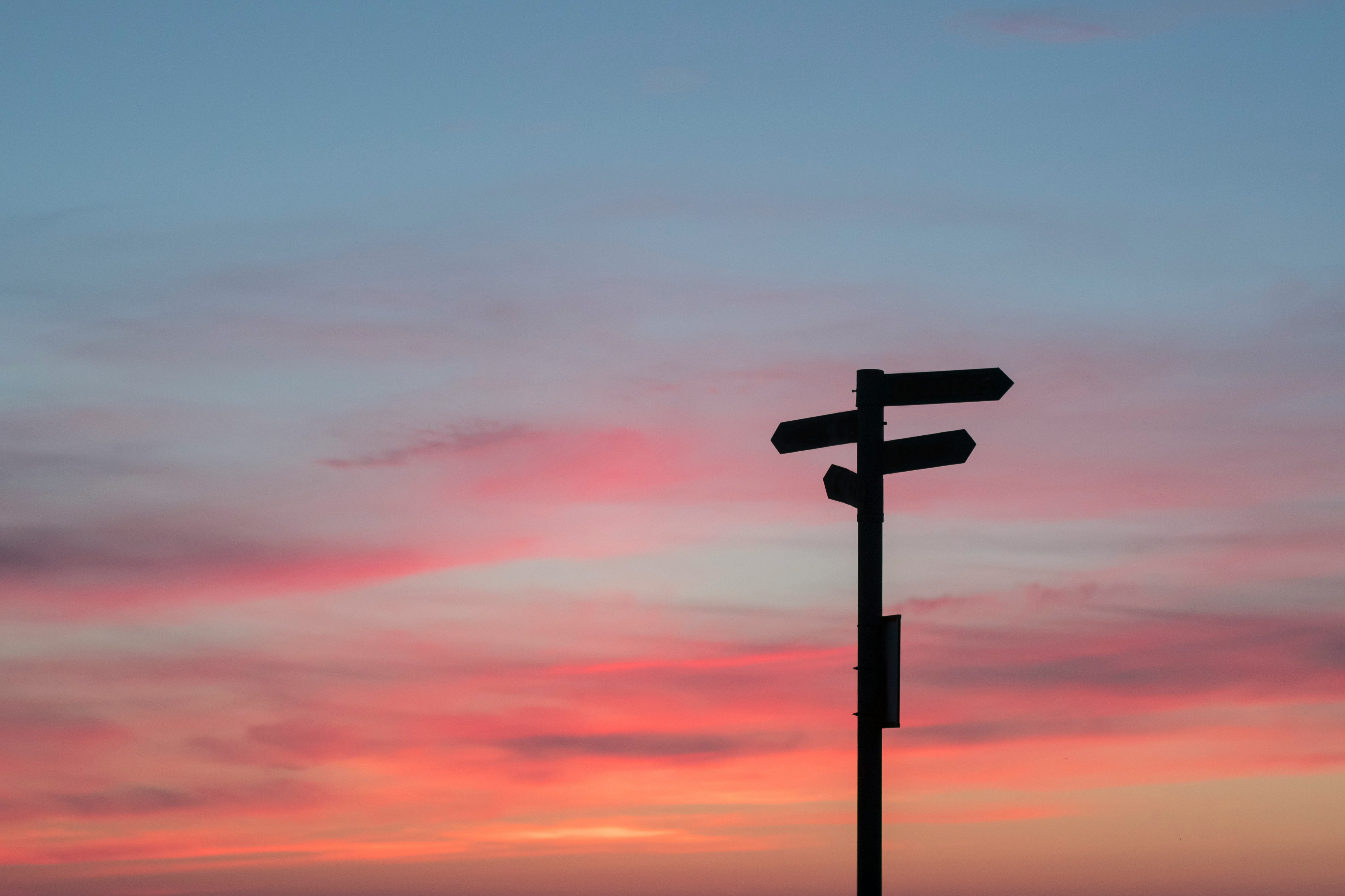 Decorative element: Crossroad sign in front of the evening sky